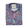 A folded long-sleeve button-up shirt with a vibrant paisley pattern in blue, purple, red, and white, featuring a visible Melco brand label on the collar.