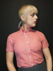 Person wearing a red and white checkered shirt against a black background